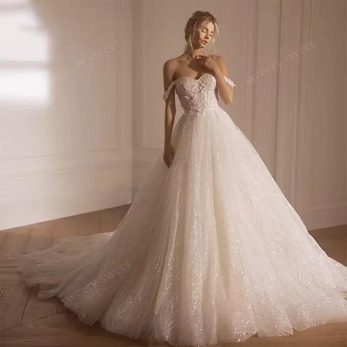 Robes de mariée épaules dénudées en organza avec broderies et sequins, coupe trapèze, sans manches, 