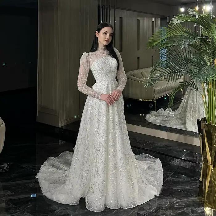 Robe de mariée trapèze en dentelle perlée de luxe, effet d'illusion de Tulle, col haut, manches long