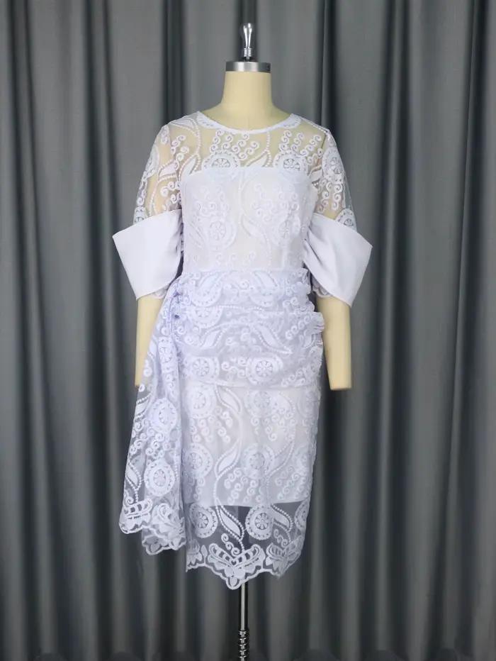 Robe mi-longue brodée à col rond pour femme