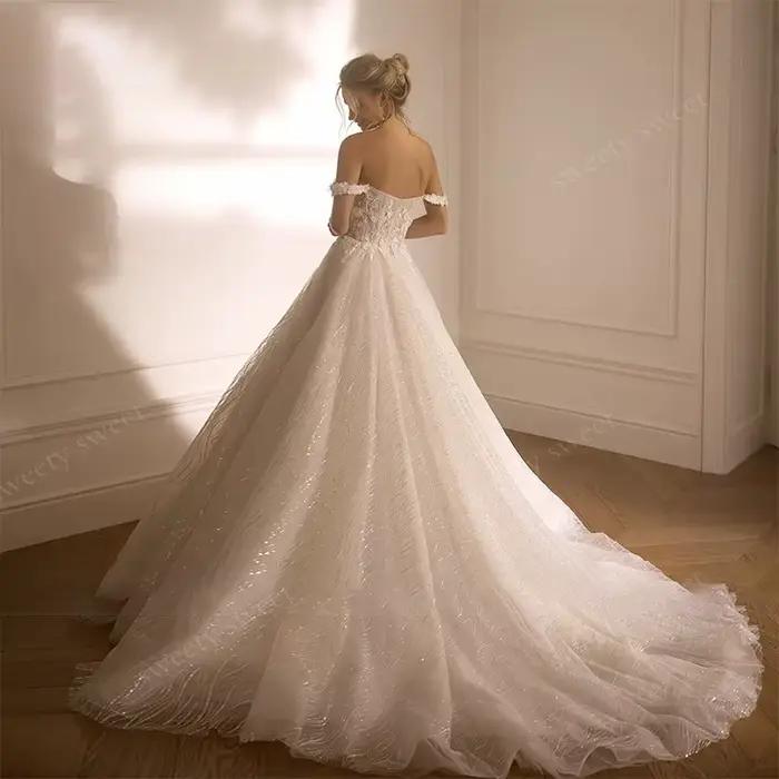 Robes de mariée épaules dénudées en organza avec broderies et sequins