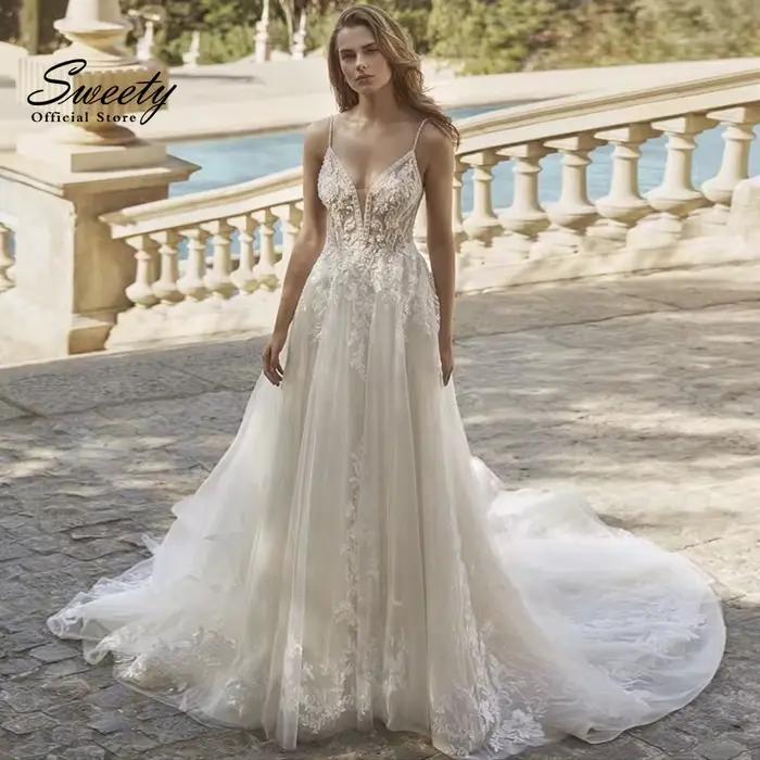 Robe de mariée en dentelle brodée sur filet