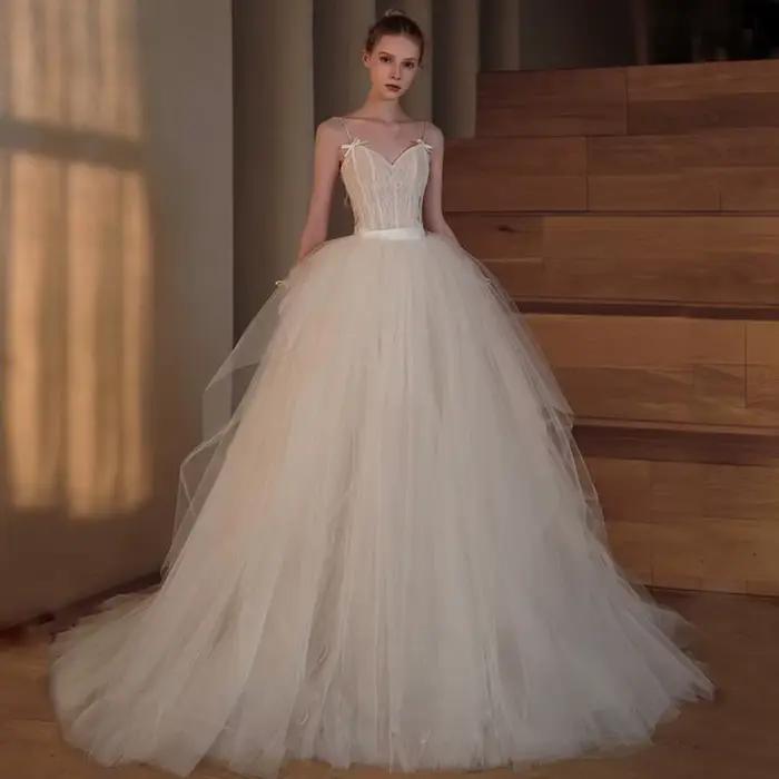 Robes de mariée rétro à bretelles spaghetti avec nœud en dentelle romantique à la française