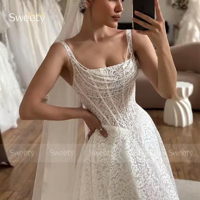 Robe de mariée élégante en dentelle brodée sur filet