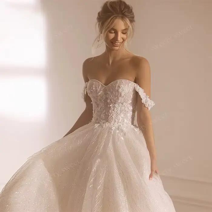 Robes de mariée épaules dénudées en organza avec broderies et sequins