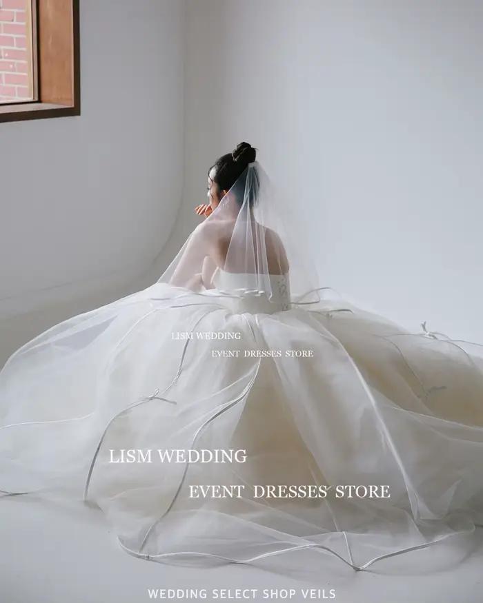 LISM élégant bretelles une ligne corée robes de mariée fée Tulle arc robe