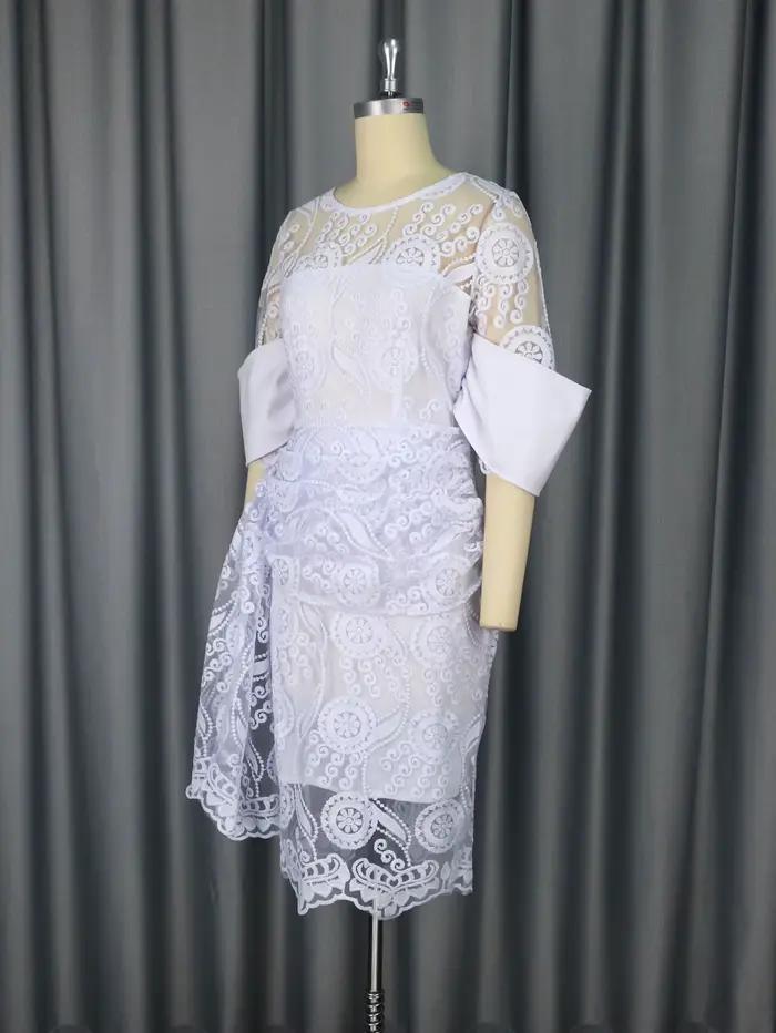 Robe mi-longue brodée à col rond pour femme