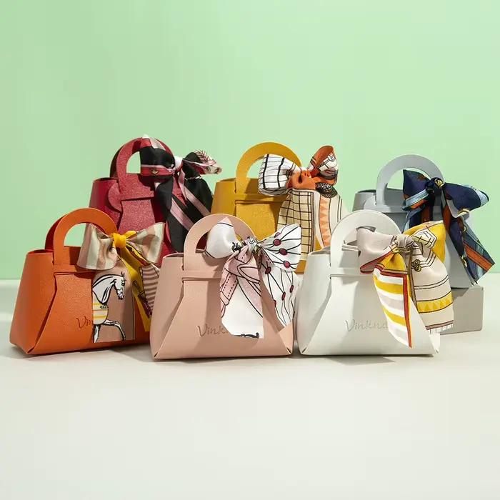 Sac cadeau en cuir avec logo personnalisé avec ruban, boîte à bonbons de mariage, décor Eid Mubarak, petit cadeau portable, sac à main d'emballage de bijoux en PU