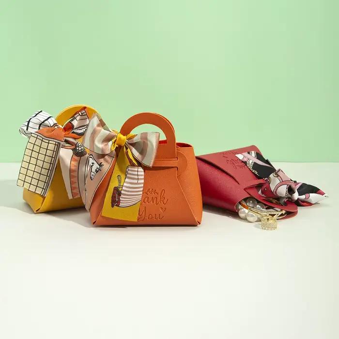 Sac cadeau en cuir avec logo personnalisé avec ruban, boîte à bonbons de mariage, décor Eid Mubarak, petit cadeau portable, sac à main d'emballage de bijoux en PU