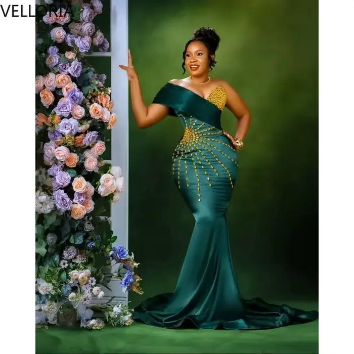 Robe sirène africaine vert émeraude sans manches épaules dénudées perles dorées cristal mariage bal de promo soirée officielle