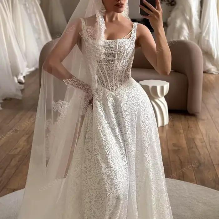 Robe de mariée élégante en dentelle brodée sur filet