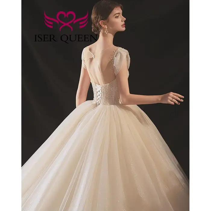 Robe de mariée de luxe personnalisée en tulle brillant 2026, nouvelle collection Europe, dos ajouré, richement perlée, avec traîne WX