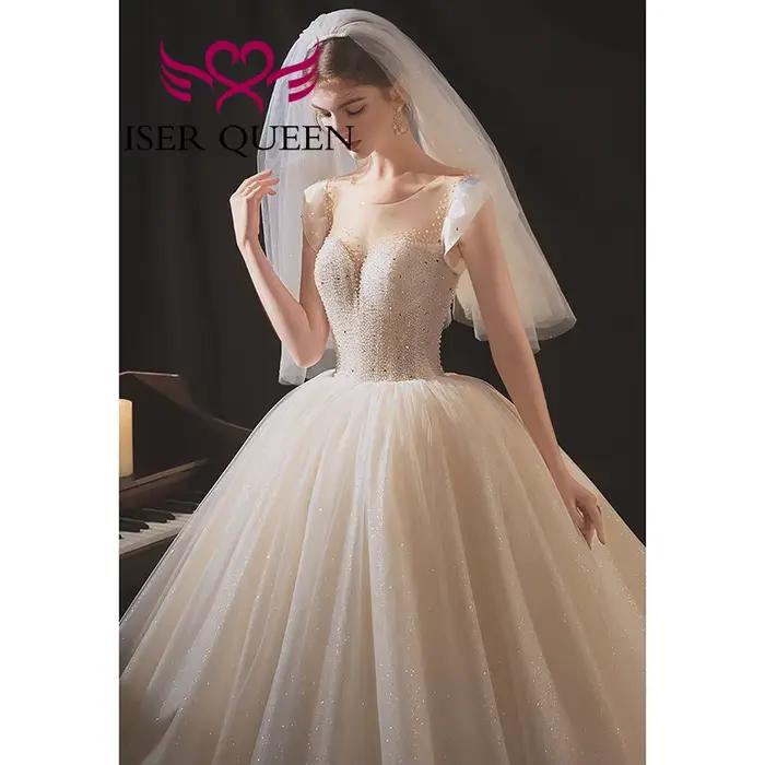 Robe de mariée de luxe personnalisée en tulle brillant 2026, nouvelle collection Europe, dos ajouré, richement perlée, avec traîne WX
