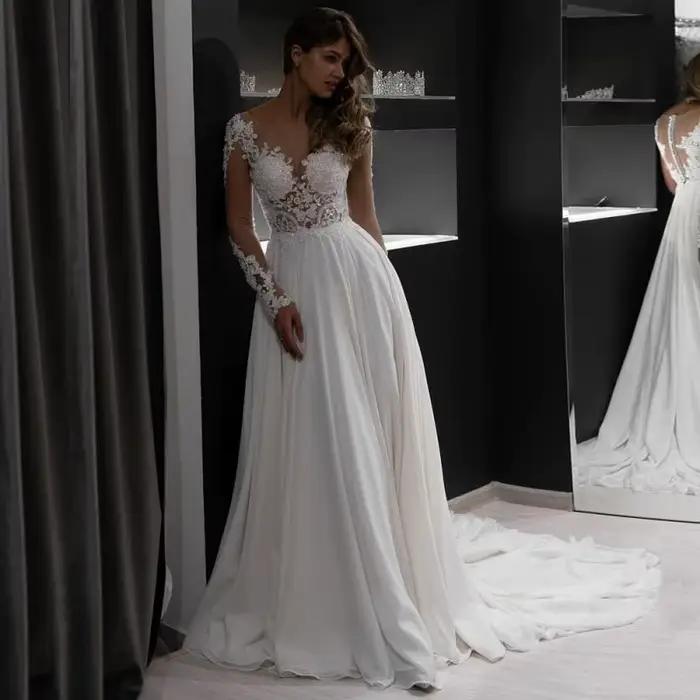 Robe de mariée en dentelle à manches longues