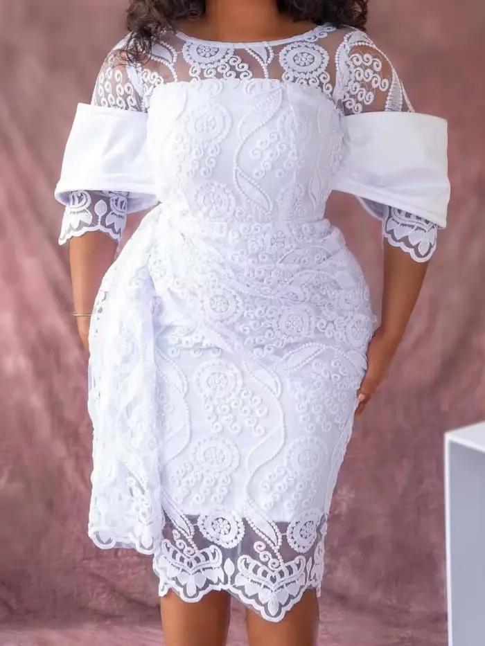 Robe mi-longue brodée à col rond pour femme