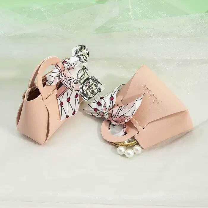 Sac cadeau en cuir avec logo personnalisé avec ruban, boîte à bonbons de mariage, décor Eid Mubarak, petit cadeau portable, sac à main d'emballage de bijoux en PU
