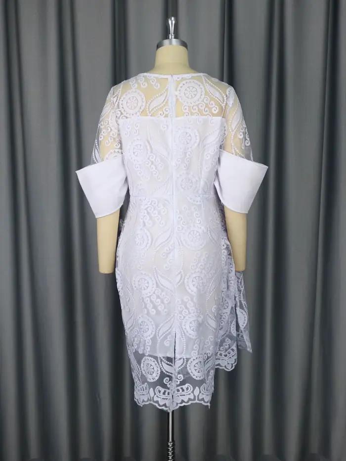 Robe mi-longue brodée à col rond pour femme