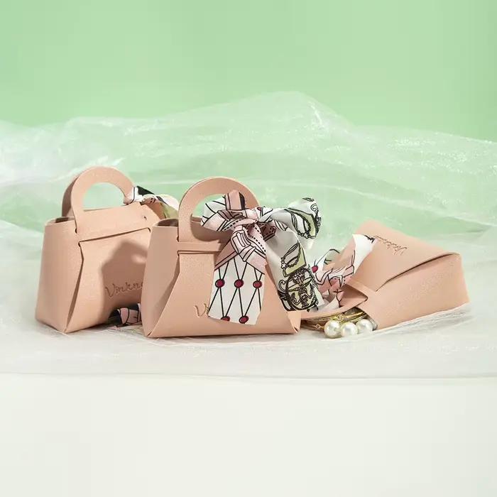 Sac cadeau en cuir avec logo personnalisé avec ruban, boîte à bonbons de mariage, décor Eid Mubarak, petit cadeau portable, sac à main d'emballage de bijoux en PU