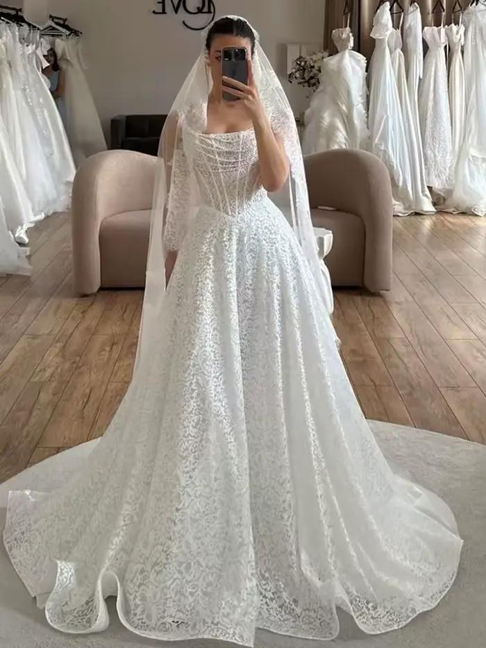 Robe de mariée élégante en dentelle brodée sur filet