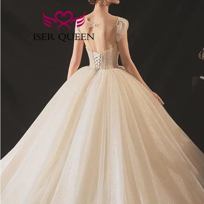 Robe de mariée de luxe personnalisée en tulle brillant 2026, nouvelle collection Europe, dos ajouré, richement perlée, avec traîne WX